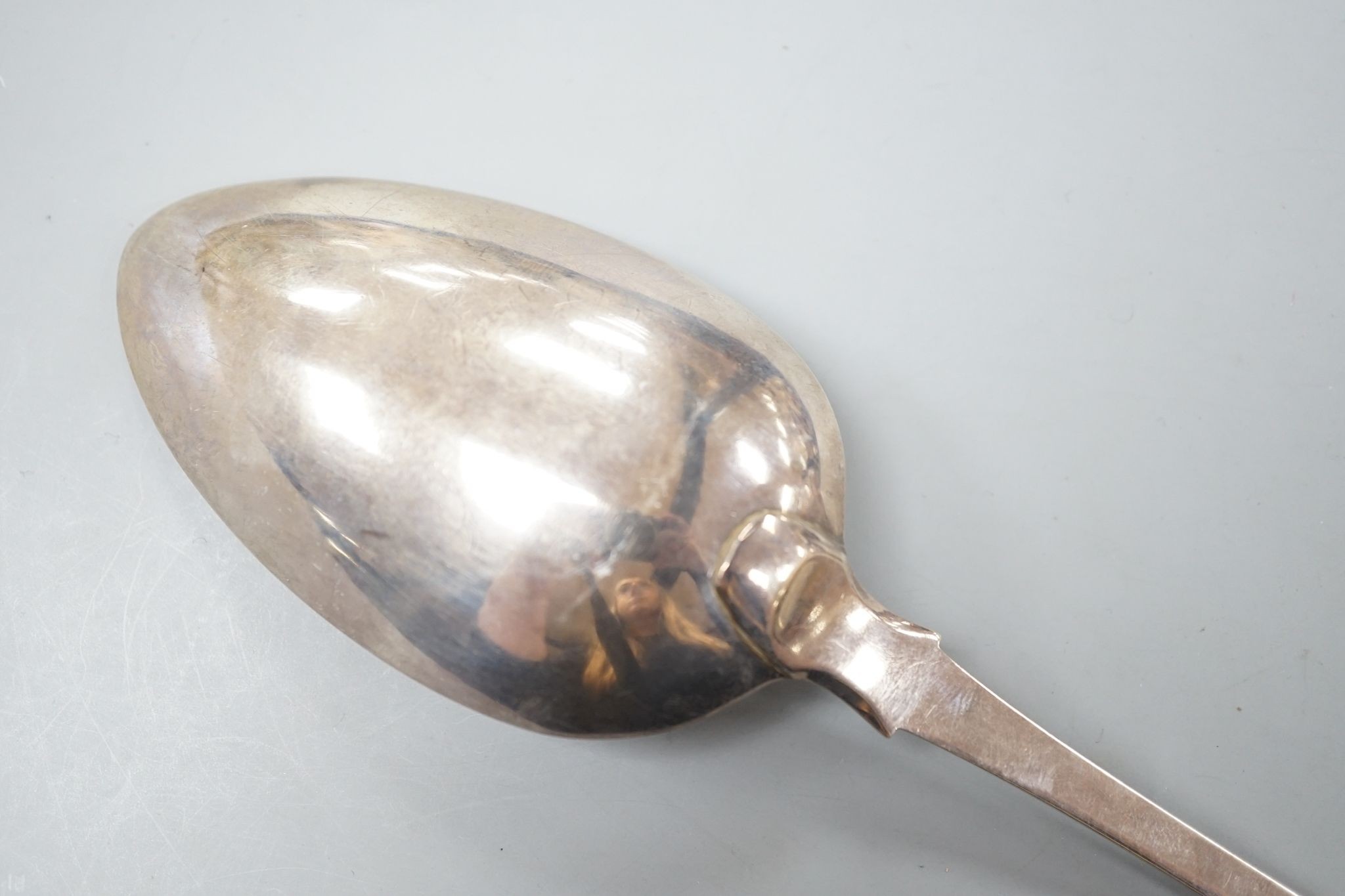 A George III silver fiddle pattern basting spoon, William Seaman, London, 1816, 31.5cm, 109 grams.